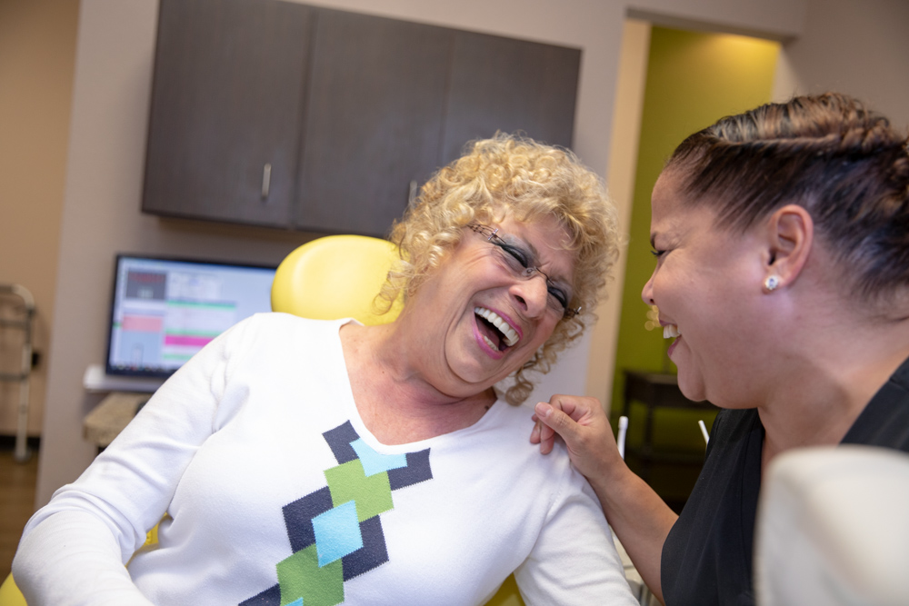 happy full arch dental implant patient Ocala, FL