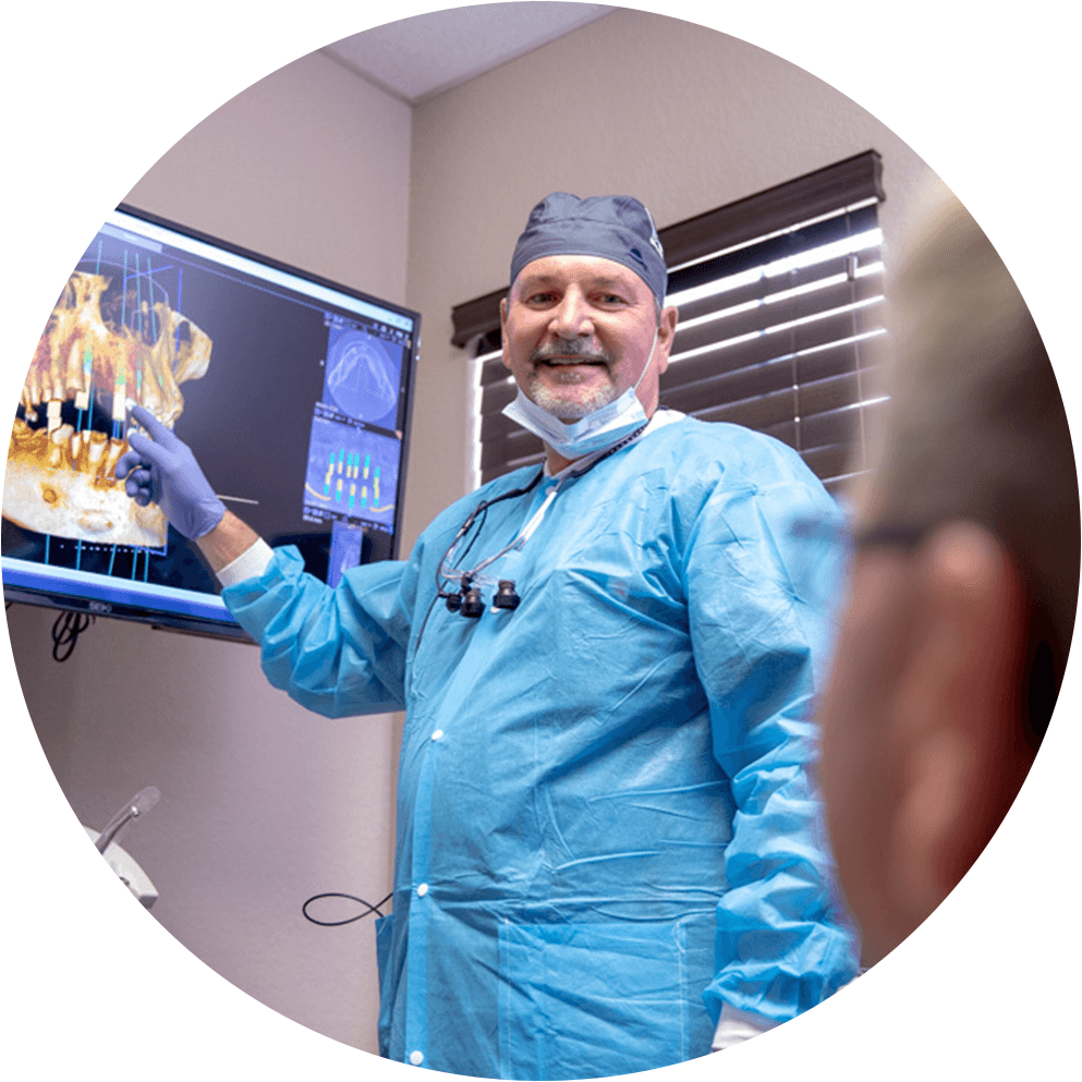 Dr Brand talking to patient about zirconia dental implants as an option Ocala , FL