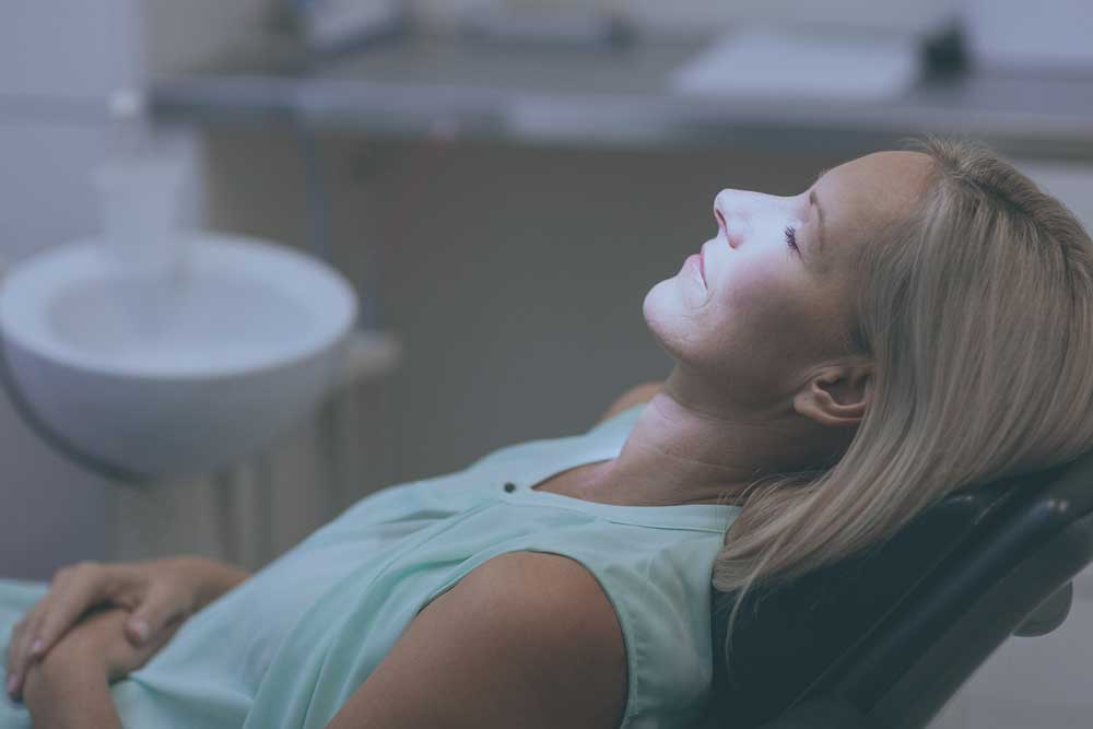 dental patient using iv sedation to help with dental anxiety