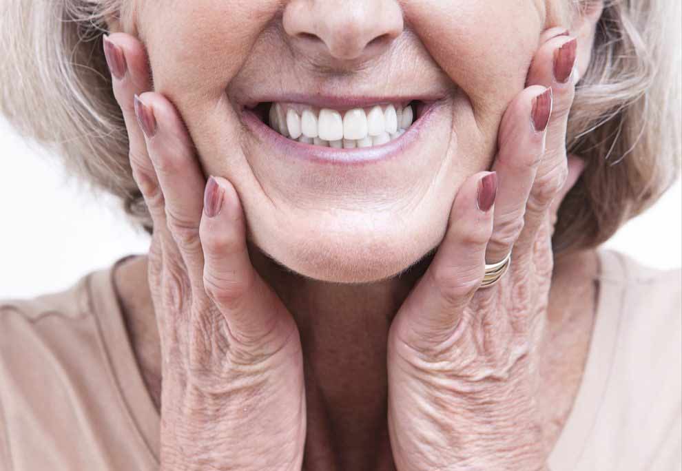 patient smiling with full mouth dental implants