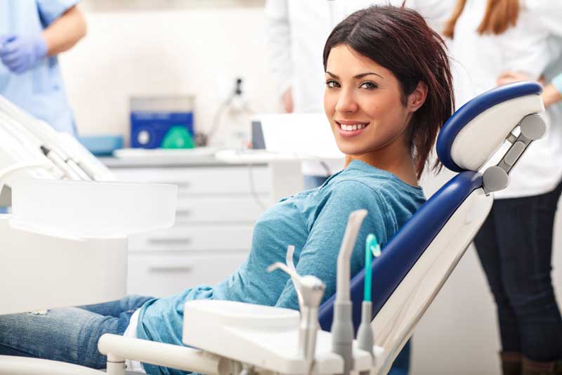 a patient smiling after her dental treatment with sedation