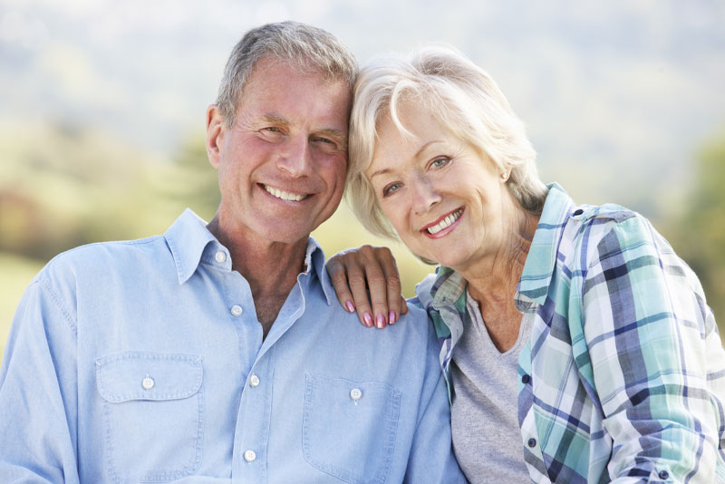 Dental Implant Patients Happily Smiling After Their Dental Implant Procedures
