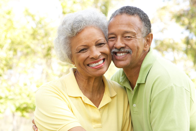 Dental Patients Smiling Together With Dental Implants