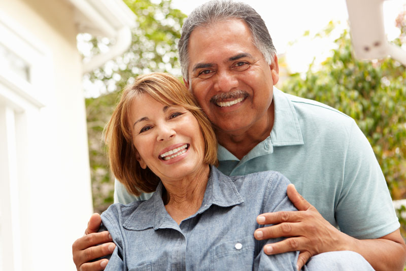 dental patients smiling after their dental implant procedure