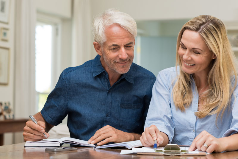 dental implant patients calculating the cost of a procedure