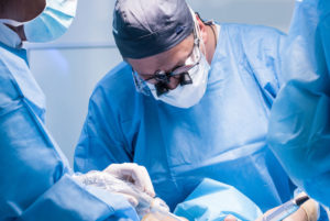 a dental implant dentist placing dental implants.