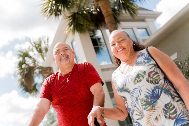 Dental Implant Patients Smiling With New Smile