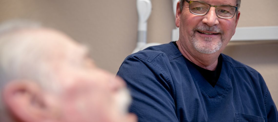 Dr Brand with dental patient Ocala , FL