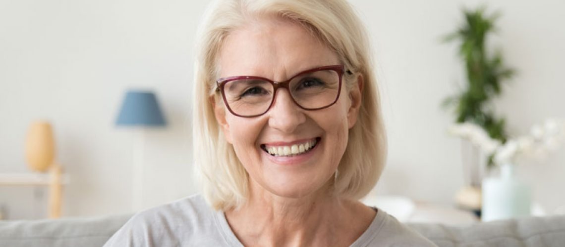 Dental Patient Smiling With Her Dental Implants