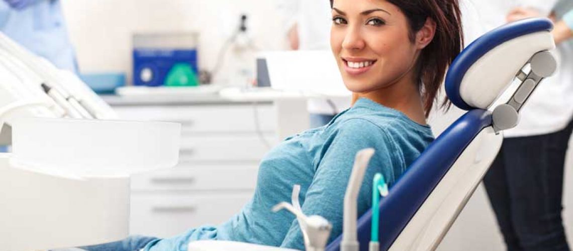 a patient smiling after her dental treatment with sedation