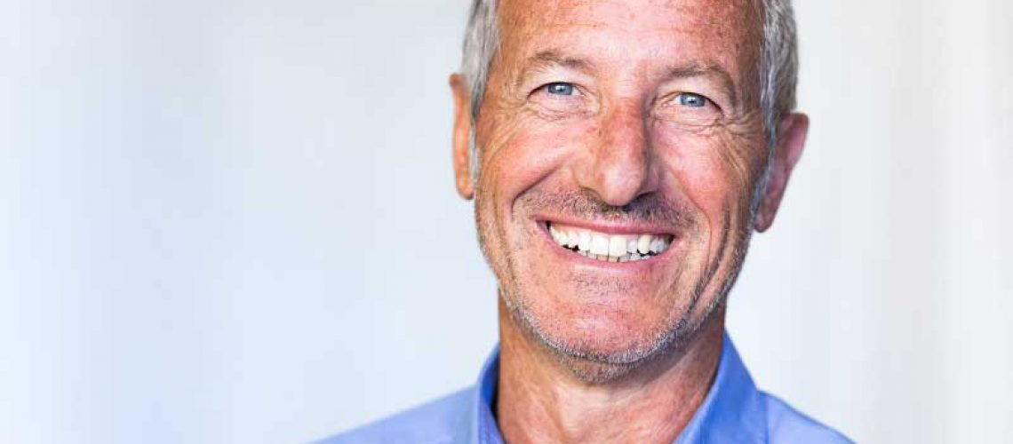 a patient smiling after his dental implant treatment